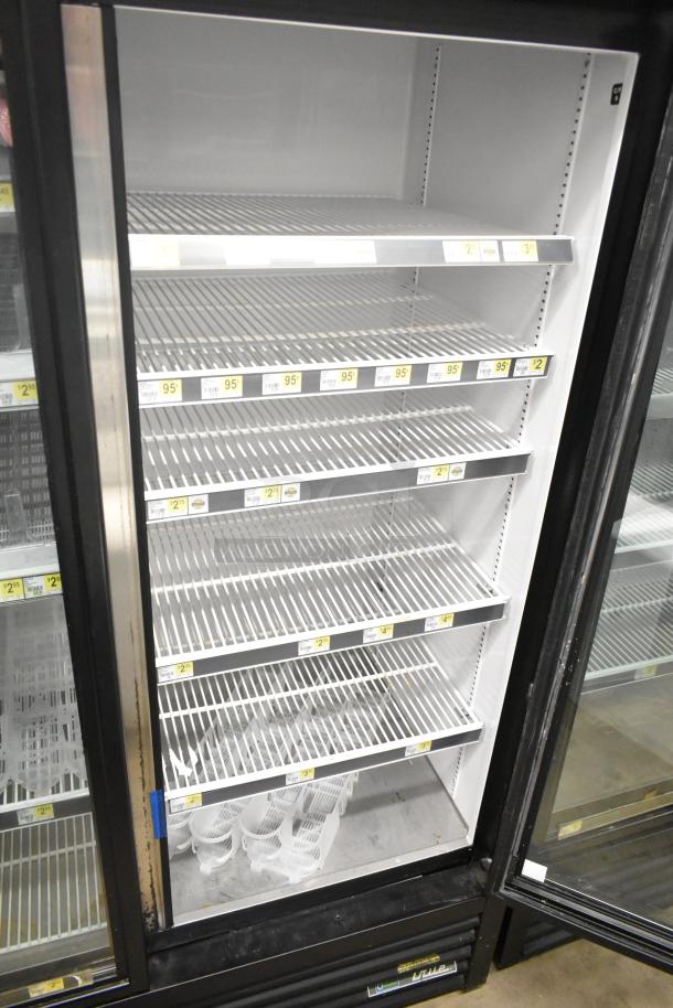 2018 True GDM-72-HC commercial reach-in cooler, 3 doors, 115 volts, 1 phase, empty shelves, minor wear, clean interior.