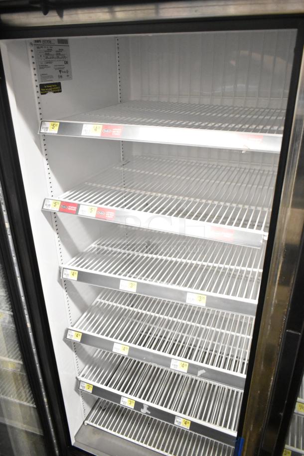 2018 True GDM-72F-HC 3-Door Reach-In Freezer with shelving, commercial use. Model label indicates 115/208-230V, 1 Phase.