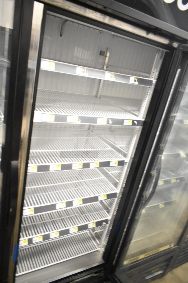 2018 True GDM-72F-HC commercial 3-door reach-in freezer merchandiser, featuring glass doors and adjustable shelving.