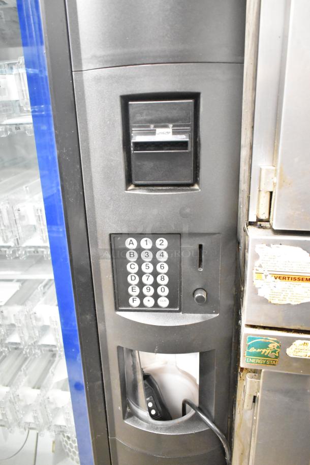 Crane 5800-4 commercial vending machine with bill acceptor, keypad, and energy label. 115 volts, 1 phase.