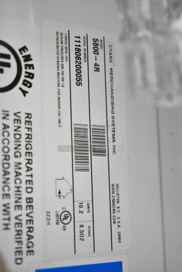 Crane 5800-4 metal commercial drink vending machine, includes bill acceptor, 115V, 1 phase, with energy certification label.