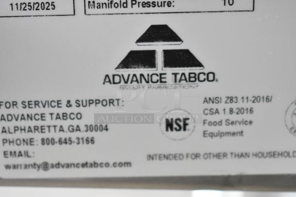 Alt text: Label on Advance Tabco HF-3G-LP hot food table, shows NSF certification and service info.