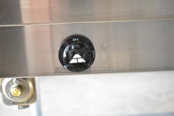 Alt text: Close-up of control knob on 2025 Advance Tabco HF-3G-LP hot food table, showing "Off" and "High" settings.