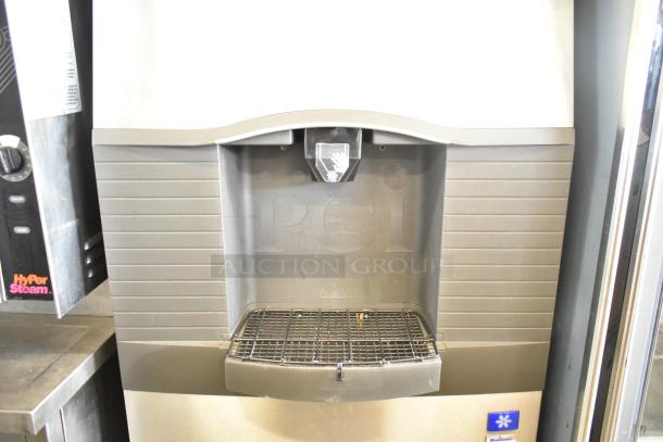 Manitowoc SD0452A Ice Machine on SPA310 Hotel Dispenser, 115 Volts, shown in good condition, commercial use.