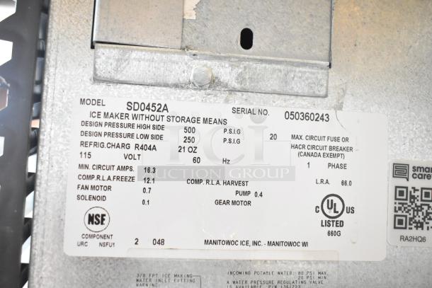 Manitowoc SD0452A ice machine label showing specifications: 115V, 1 phase, NSF certified, serial number 050360243.