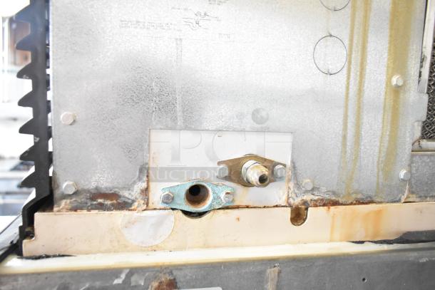 Manitowoc SD0452A ice machine head on SPA310 hotel dispenser, 115V, visible rust and wear, commercial use.