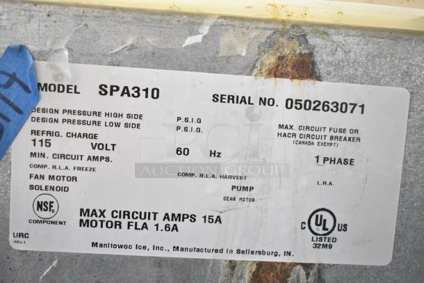 Manitowoc SPA310 hotel ice dispenser label showing model, serial number 050263071, electrical specs, and NSF/UL certifications.