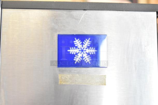 Manitowoc SD0452A ice machine head on SPA310 hotel dispenser, 115V, 1 phase. Features snowflake logo, stainless steel finish.