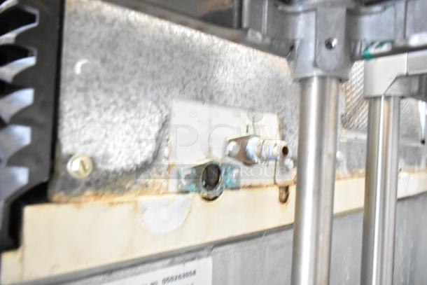 Manitowoc SD0452A ice machine head on SPA310 dispenser, 115V, 1 phase, showing rust and wear on connections.