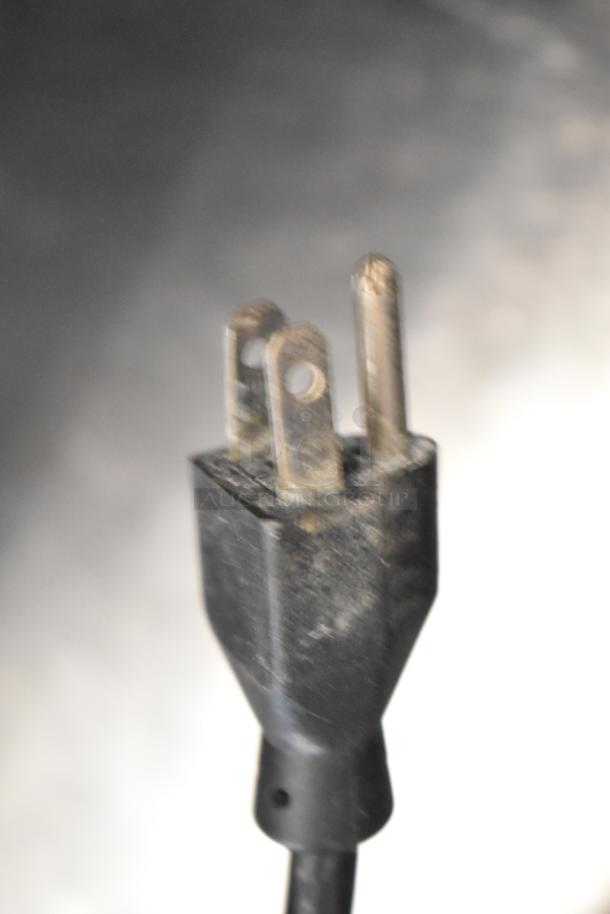 A power plug of the Manitowoc SD0452A ice machine and SPA310 dispenser, showing aged condition. 115 volts, 1 phase.