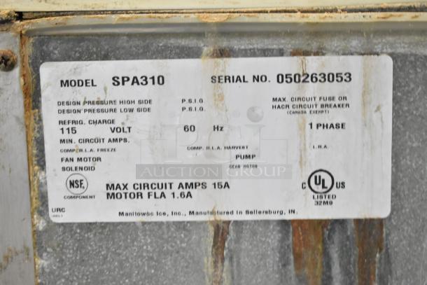 Manitowoc SD0452A ice machine head on SPA310 hotel ice dispenser, 115 volts, 1 phase, visible specifications label.