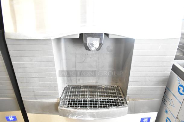 Manitowoc SD0452A ice machine head on SPA310 dispenser, 115V, 1 phase. Features durable metal finish and push-button interface.