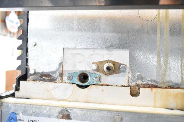 Manitowoc SD0452A ice machine head on SPA310 dispenser, visible wear and rust, 115 volts, 1 phase. Model label intact.