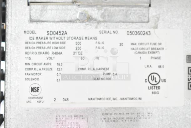 Manitowoc SD0452A ice machine label. Displays model, serial number, voltage, and certification details.