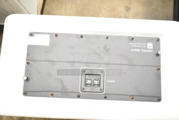 JBL Control SB2210 speaker back panel with input ports, screws, and "JBL Professional Northridge, CA USA" label visible.