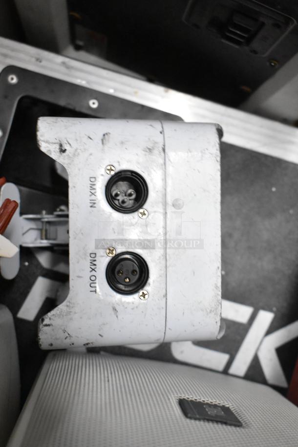 Auction items including JBL Control 25AV speaker with visible DMX IN/OUT ports, signs of wear. Part of a mixed equipment lot.