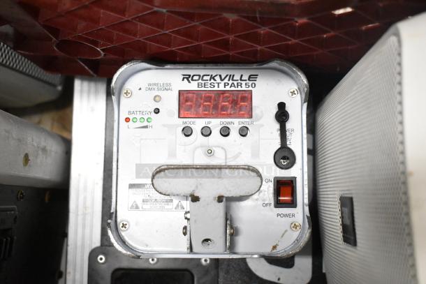 Rockville Best Par 50 light panel with control buttons and battery indicators, alongside JBL Control 25AV speaker.
