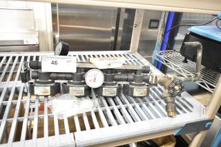 Everpure InsurIce 4000 Water Filtration System, featuring multiple filter units, pressure gauge, and labeled components. Good condition.