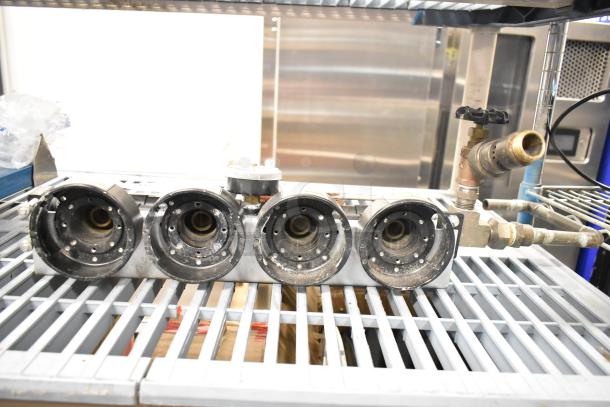 Everpure InsurIce 4000 Water Filtration System, used condition, features 4 cartridge holders and metal connectors.