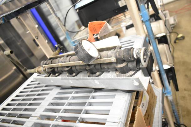 Everpure InsurIce 4000 Water Filtration System, gauge visible, metal frame, used condition, for commercial use.