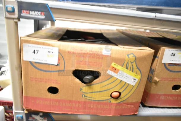 Box of 80 sharpened stainless steel knives, including a chef knife, displayed on a shelf. Box marked as item 47, qty 80.