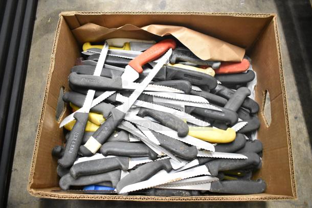 Box of 80 sharpened stainless steel knives, various colored handles, includes serrated knives, used condition.