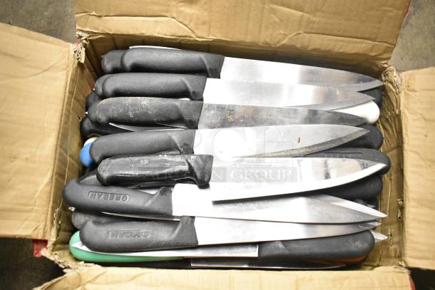 Cardboard box containing 50 sharpened stainless steel knives with black handles, including chef knives; some handles marked "CREBAN."