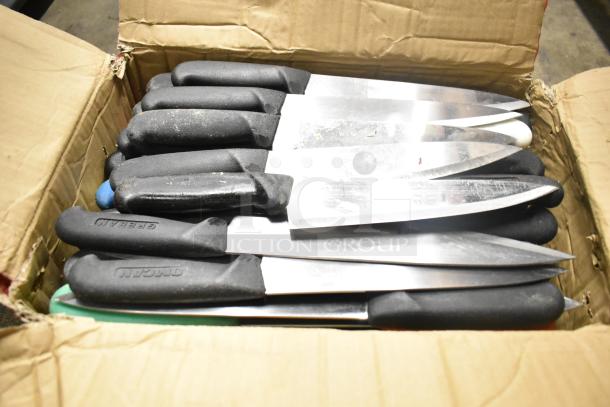 Box of 50 sharpened stainless steel knives with black handles, includes chef knife. Handles labeled "Chef," and "Ocean."