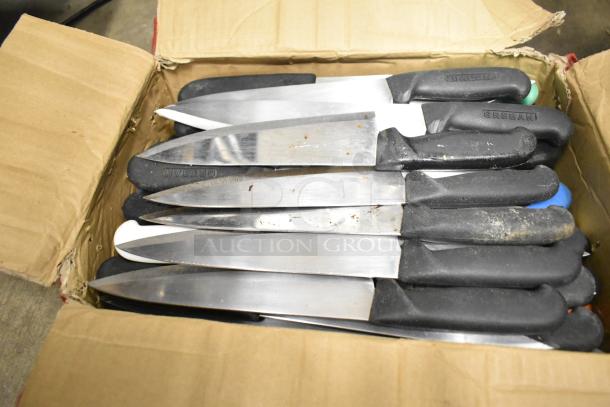 Box of 50 sharpened stainless steel knives with black handles, including chef knives. Handles show "CREBAN." Used condition.