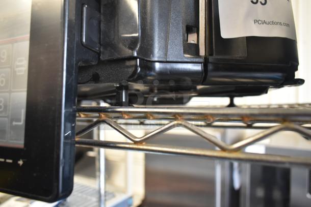 2023 Hobart HTi-7LH4W commercial food portioning scale, tested and working, shown on metal shelf, side view with screen and base.