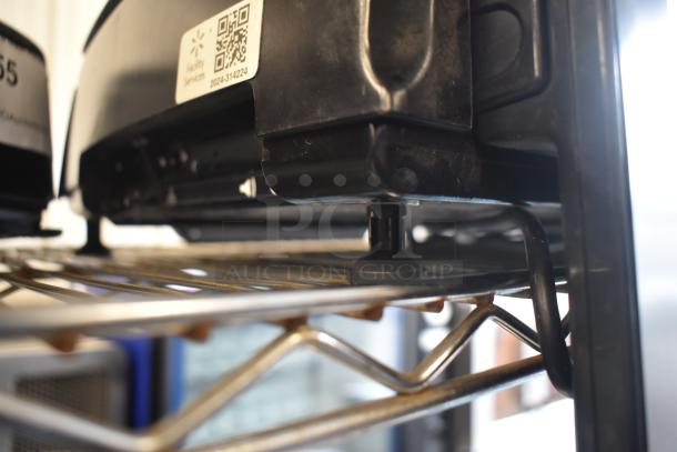 2024 Hobart HTi-7LH4W commercial food scale on metal shelf, tested working, with visible screen damage. Power: 120/208-240V, 1 Phase.