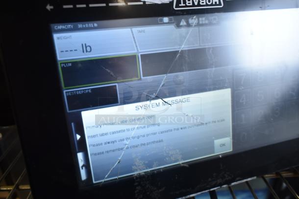 2024 Hobart HTi-7LH4W food portioning scale, screen damage visible. Capacity: 30 lb. Tested, 120/208-240V, 1 phase.