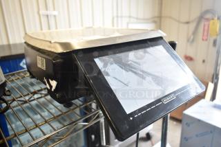 2017 Hobart HTi-7LH26 food portioning scale with screen damage. Model HTi-7LH26, 120/208-240V, 1 phase.