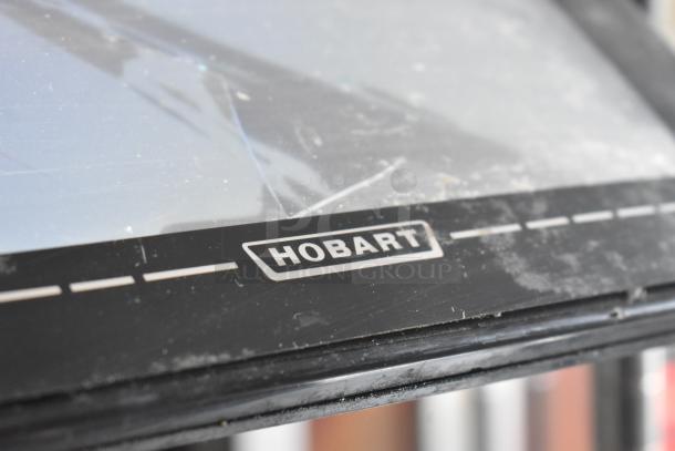 2017 Hobart HTi-7LH26 commercial scale, visible brand logo, screen damage noted, 120/208-240V, 1 phase.