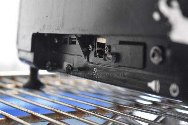 2017 Hobart HTi-7LH26 commercial countertop scale. Features metal base and connection ports. Screen damage noted.