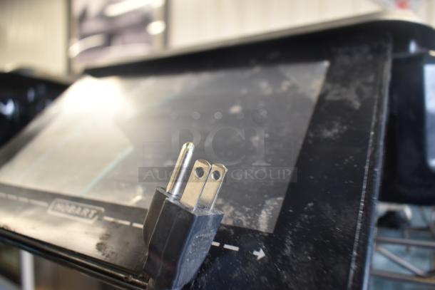 2017 Hobart HTi-7LH26 food portioning scale, visible screen damage, Hobart branding, 120/208-240V plug shown.