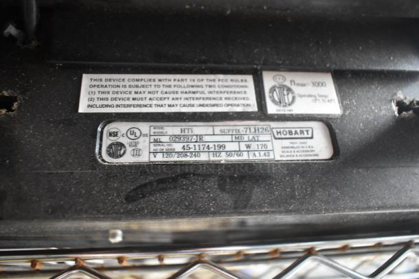 2017 Hobart HTi-7LH26 commercial food scale label, showing model and voltage details. Tested and working condition.