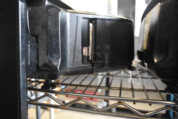 2020 Hobart HTi-7LH4W commercial food scale on a metal rack, black casing, tested and working, good condition.