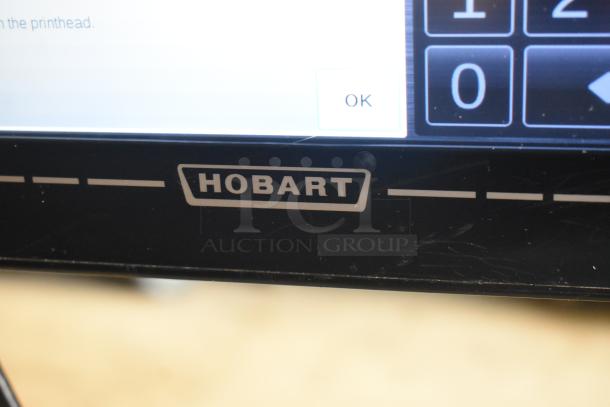 2017 Hobart HTi-7LH26 commercial scale. Tested, working condition. Black casing with visible Hobart logo. 120/208-240V, 1 Phase.