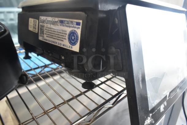 2017 Hobart HTi-7LH26 portioning scale, screen damage visible, tested and working, 120/208-240V, 1 phase.