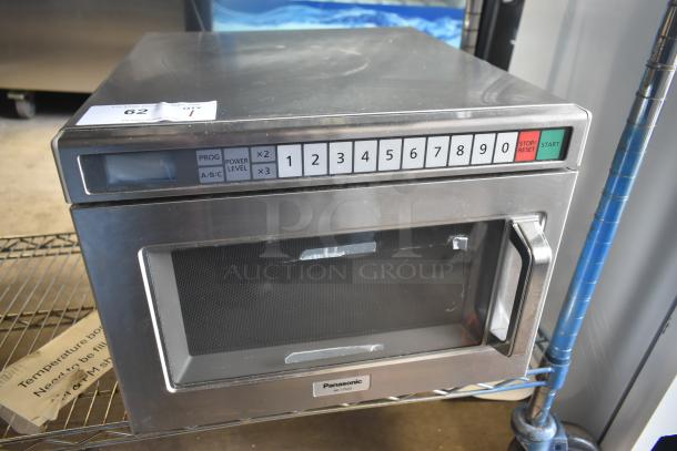 Panasonic NE-17523 commercial countertop microwave oven, keypad controls, stainless steel, 208/240V, 1 phase, model label visible.