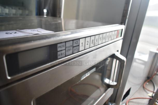 Panasonic NE-17523 commercial countertop microwave oven, stainless steel, 208/240V, keypad controls, used condition.