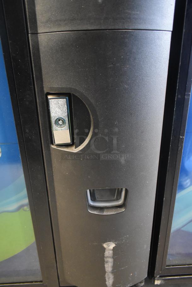 Crane 5800-4 metal drink vending machine with bill acceptor; 115 volts, 1 phase. Visible wear on surface.