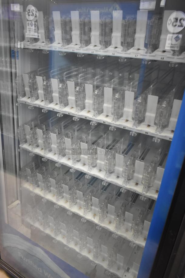 Crane 5800-4 metal commercial bottled drink vending machine with bill acceptor, 115 volts, 1 phase, multiple shelves visible.