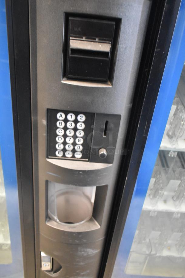 Crane 5800-4 Metal Commercial Bottled Drink Vending Machine with bill acceptor. Features keypad, coin slot, good condition.