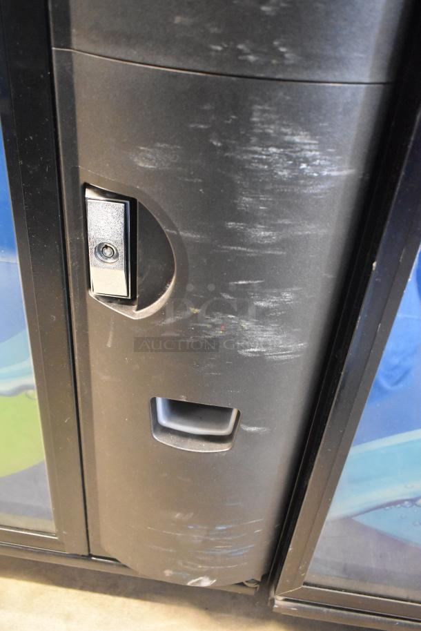 Crane 5800-4 metal commercial bottled drink vending machine with bill acceptor, showing visible wear and key lock.