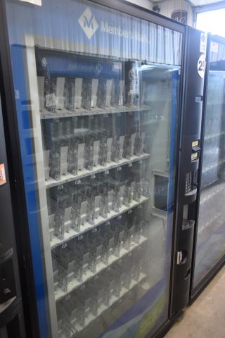 Crane 5800-4 metal commercial vending machine with bill acceptor, 115 volts, 1 phase, visible product slots, and keypad.