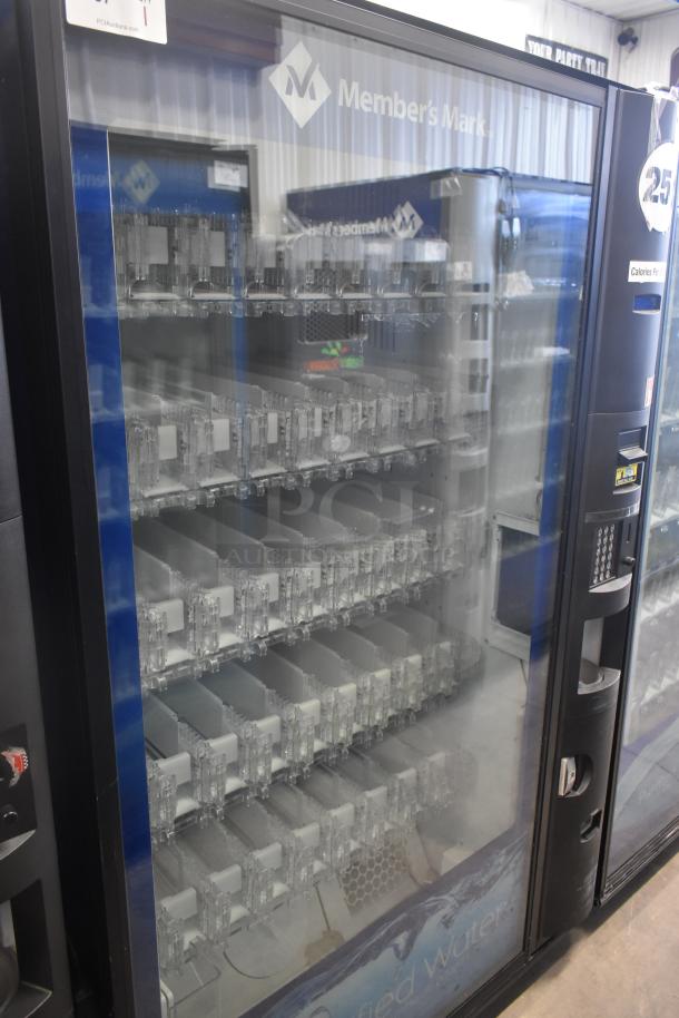 Crane 5800-4 metal vending machine with bill acceptor, 115 volts, 1 phase. Clear front, multiple shelves, commercial condition.