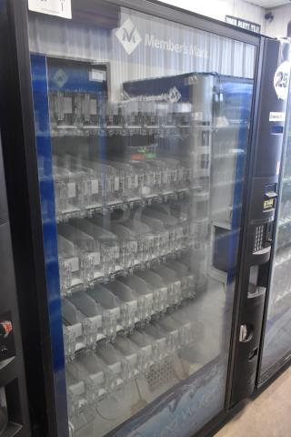 Crane 5800-4 metal vending machine with bill acceptor, 115 volts, 1 phase. Clear front, multiple shelves, commercial condition.