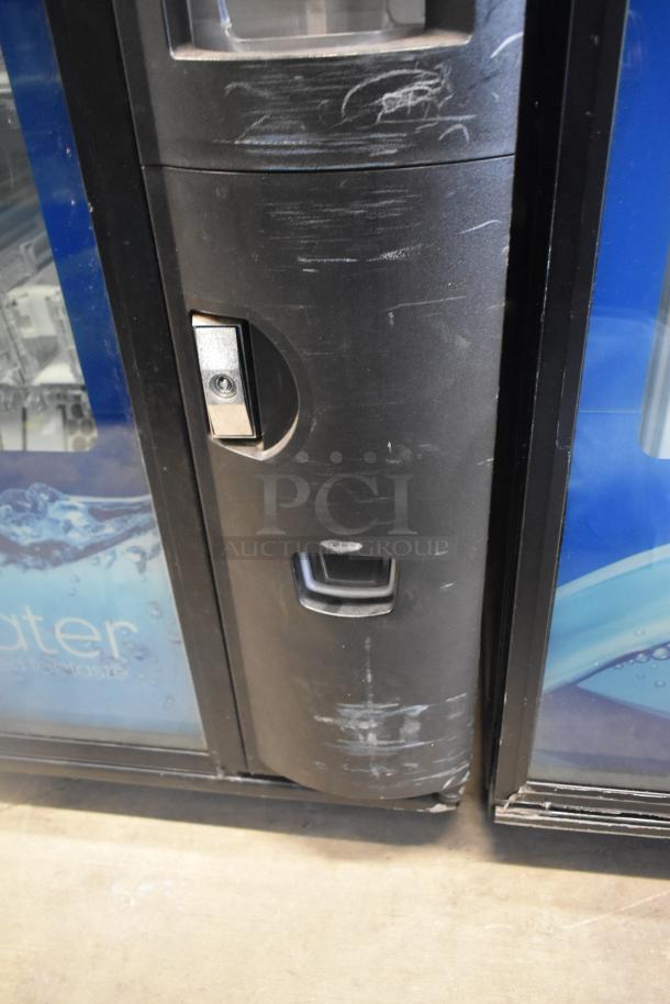 Crane 5800-4 metal drink vending machine with bill acceptor, visible wear. 115 volts, 1 phase, for commercial use.